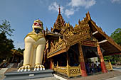 Yangon Myanmar. Shwedagon Pagoda (the Golden Stupa). The southern entrance guarded by two colossal chinthe (half lion, half-dragon guardian figures). 